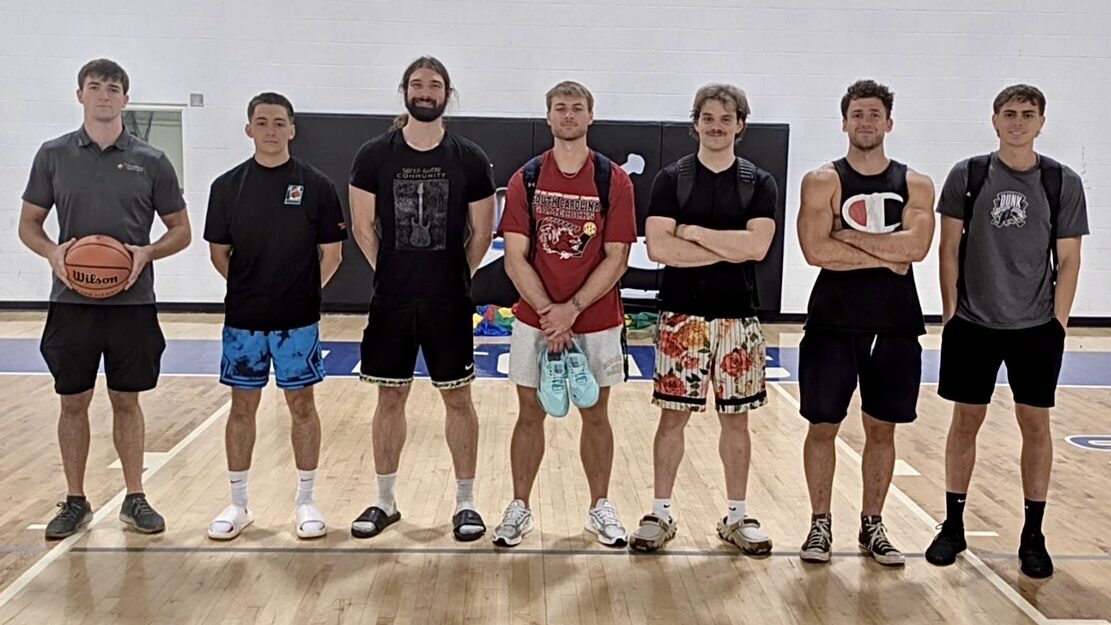 Seven dunkers standing together in a gym in North Carolina in 2026
